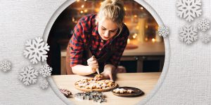woman making cookies in kitchen at holidays