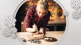 woman making cookies in kitchen at holidays