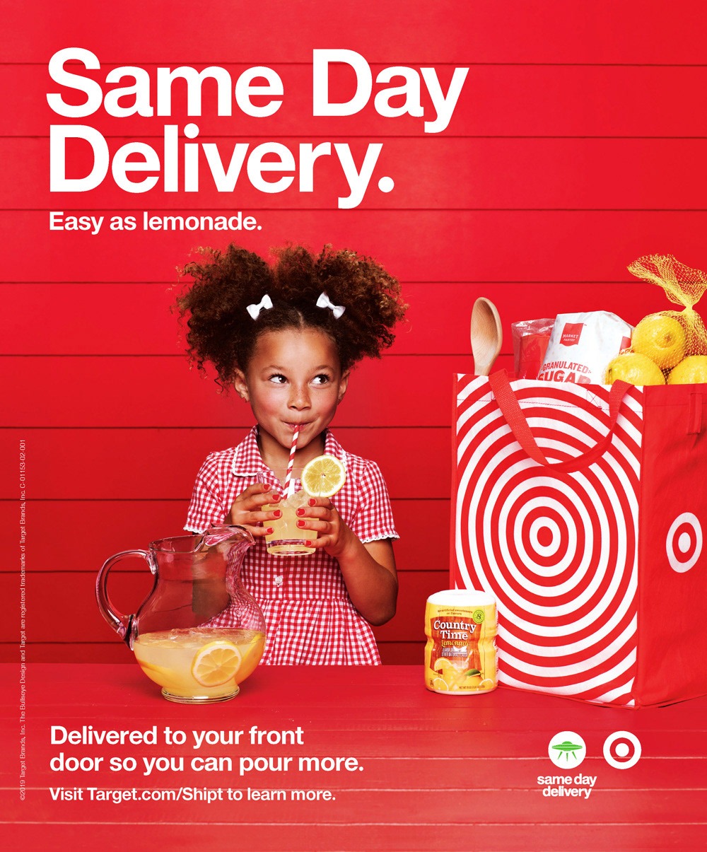 11 graphic design principles to elevate your brand 7 A Target Same Day Delivery "Easy as Lemonade" advertisement features their iconic bold red background and asymmetric design with a little girl drinking lemonade surrounded by lemonade stand supplies and a Target bullseye bag