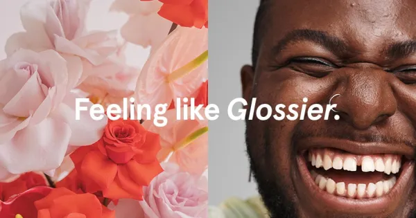 Glossier ad with a man and flowers