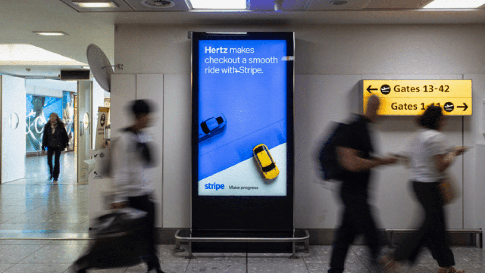 A stripe ad in an airport hallway